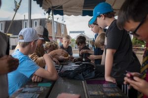 boys playing pokemon card game at camp, Pokemon Camp