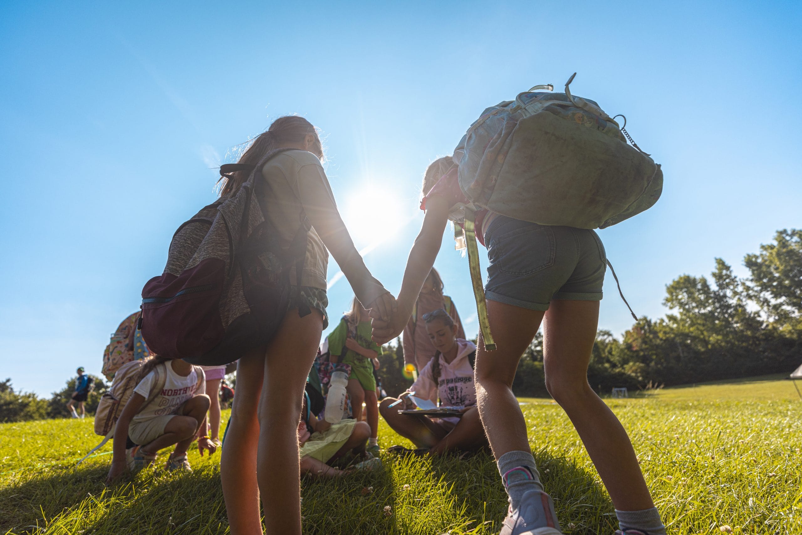 campers holding hands
