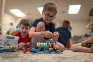 children playing with legos at camp mirage
