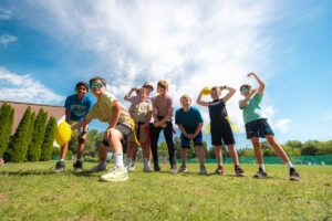 group of boys at camp playing flag football